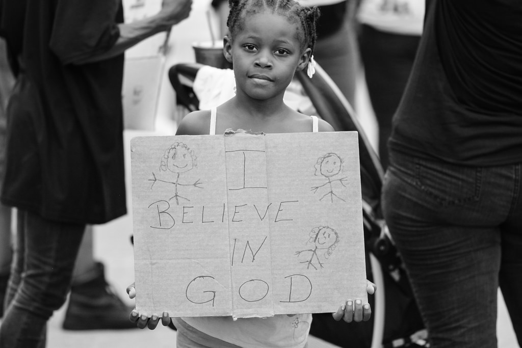 sign: "I believe in GOD"