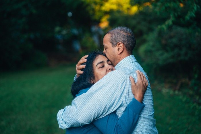 "The Faith We Struggle to Embody" - photo of two people embracing