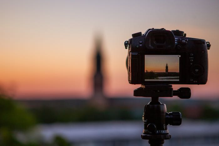 "Perspective: seeing things in different ways" - a photo of a camera in the foreground; the focus of the picture is the camera, making the background fuzzy. You can just make out what the background looks like through the camera viewfinder