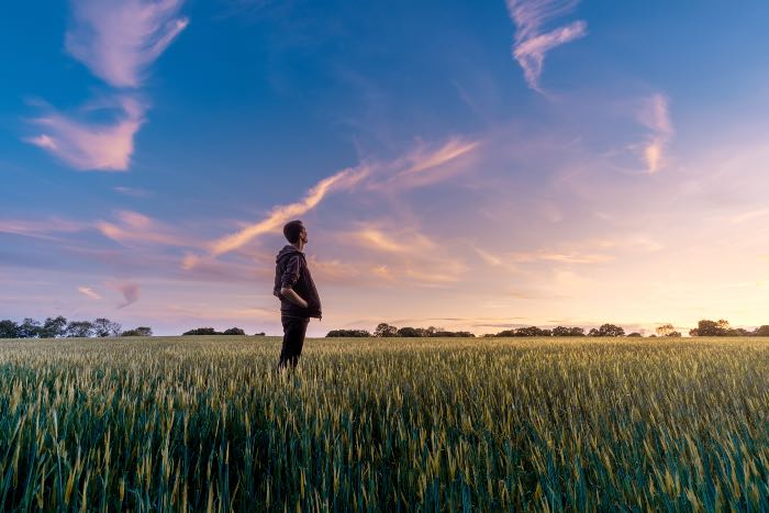 "Future Now" - a photo of a man standing in a field