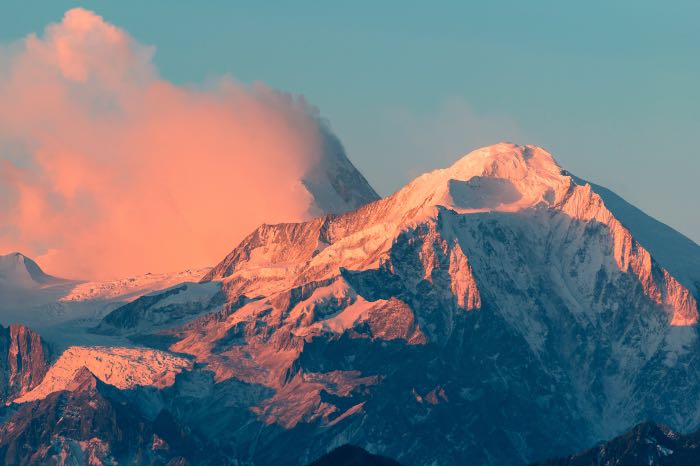 "transfiguring" - a photo of a mountain at sunrise or sunset