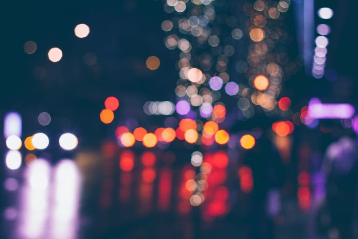 a photo of city lights at night with a Bokeh Effect to blur the image