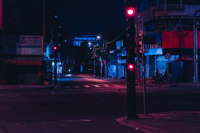 a photo of a dark street at night