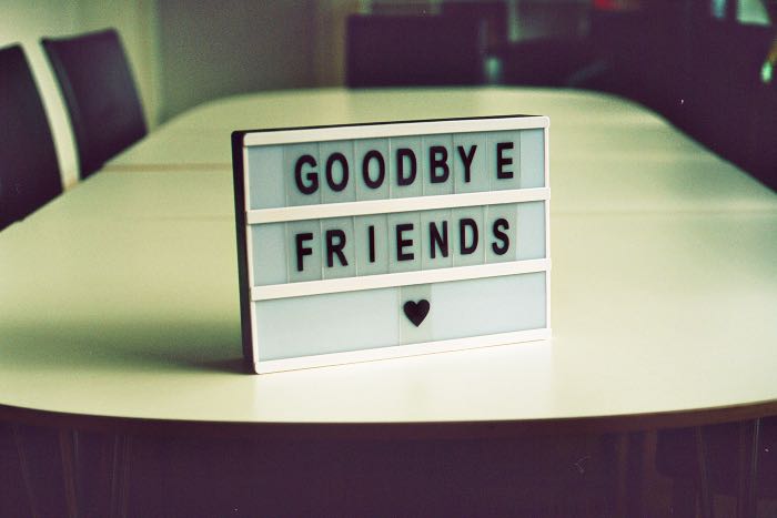 a photo of a table with a message board on it that says "Goodbye Friends"