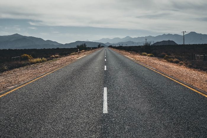 a photo of an empty road from the middle of it.