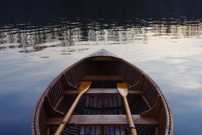 a photo of a rowboat on the water.