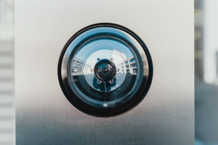 a close up photo of a camera on a doorbell.