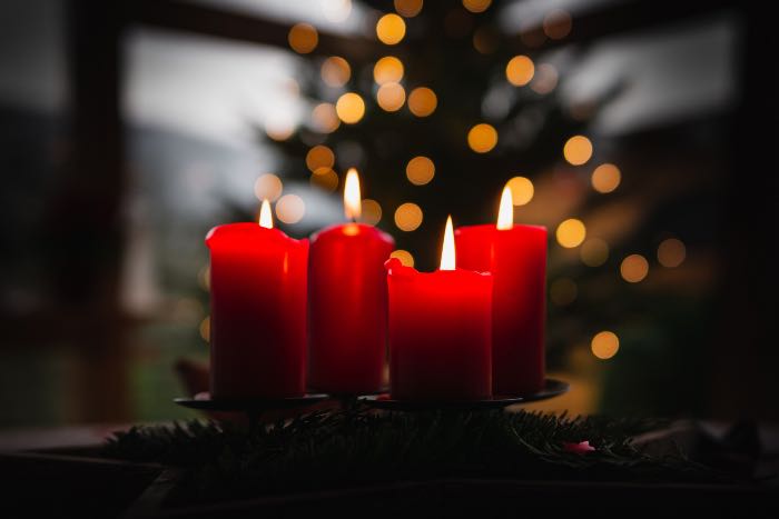 a photo of four red candles, reminiscent of an Advent wreath