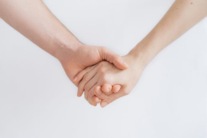 a photo of two hands holding