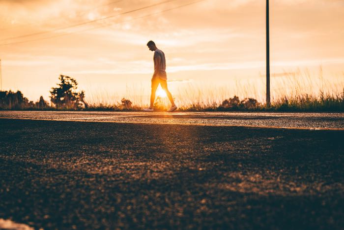 a photo of a person walking down the road