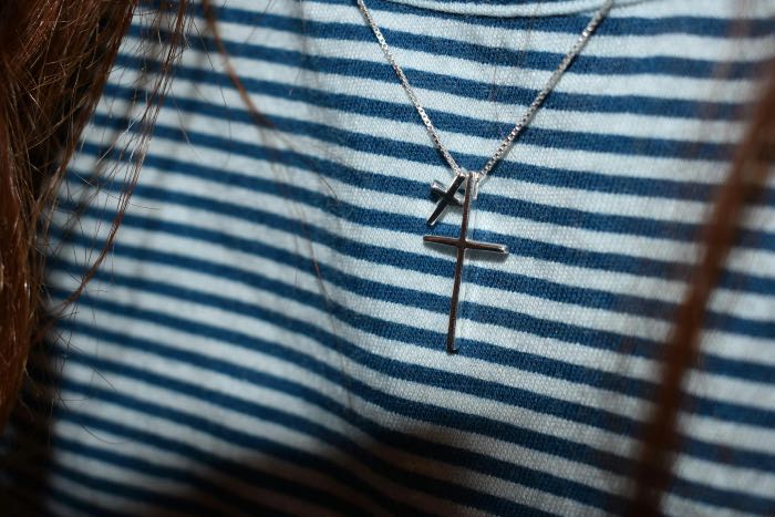 a photo of a cross necklace