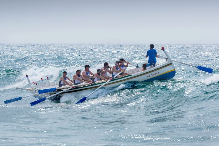 a photo of crew team rowing a boat