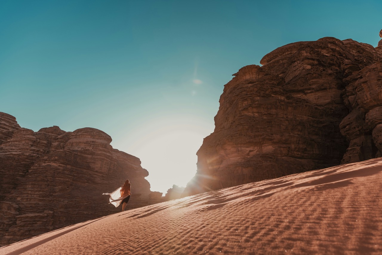 a photo of a person standing in a desert