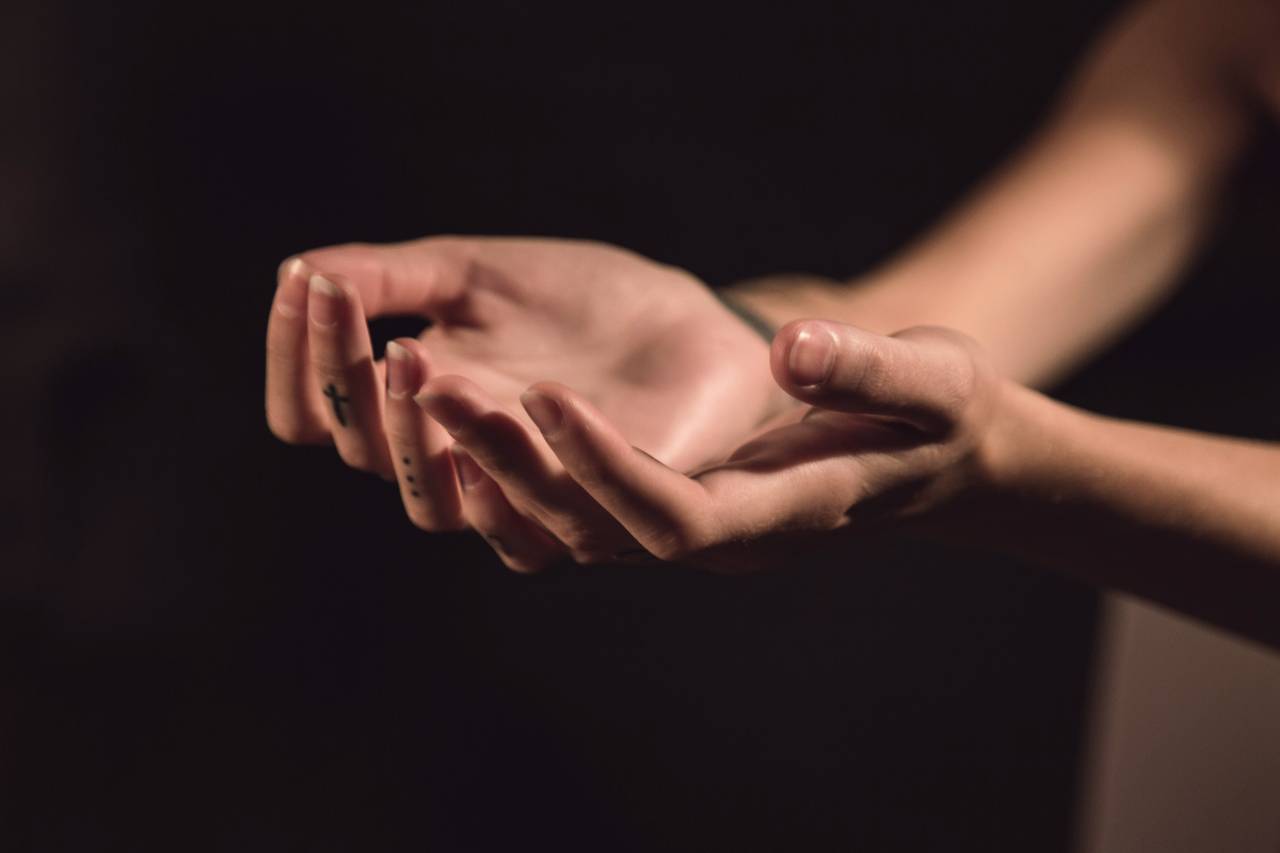 a photo of a person's hands out, facing up
