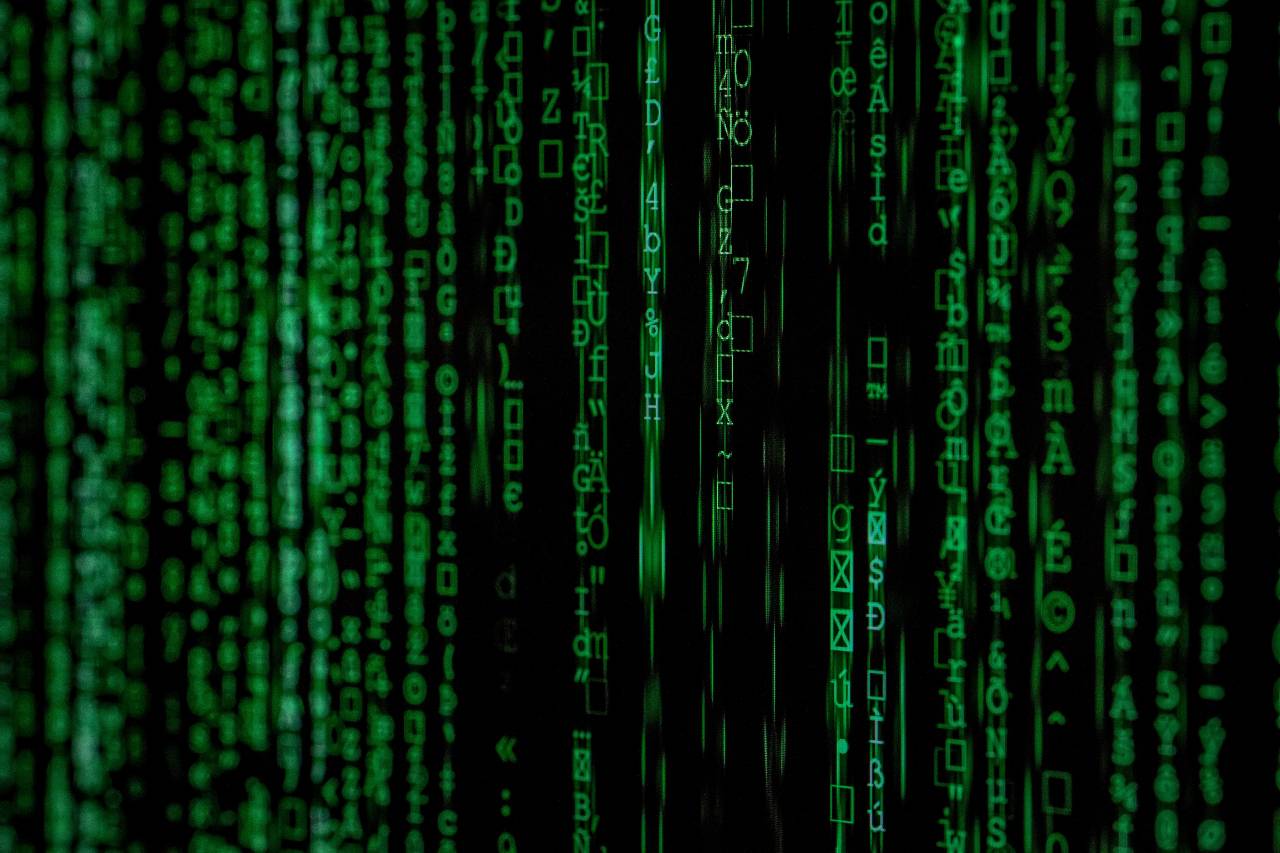 a photo of a green Matrix-like code on a black background
