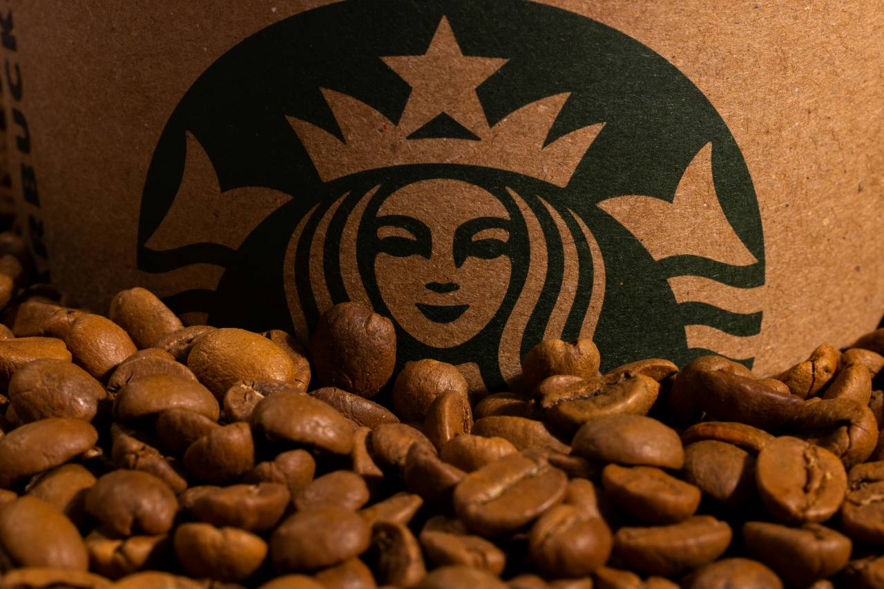 a photo of coffee beans and a Starbucks logo