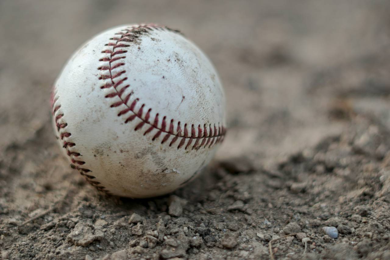 a photo of a baseball in dirt