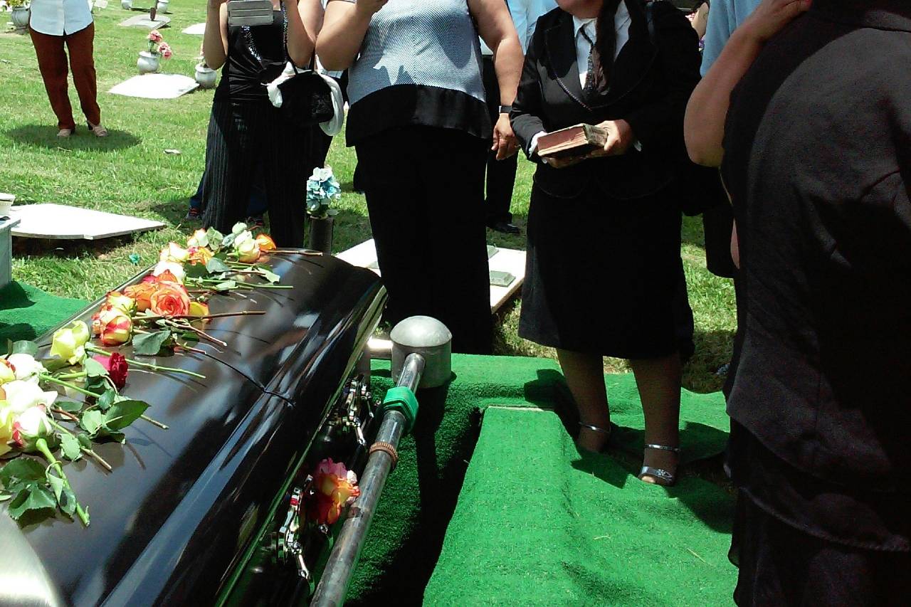 a photo of people at a burial