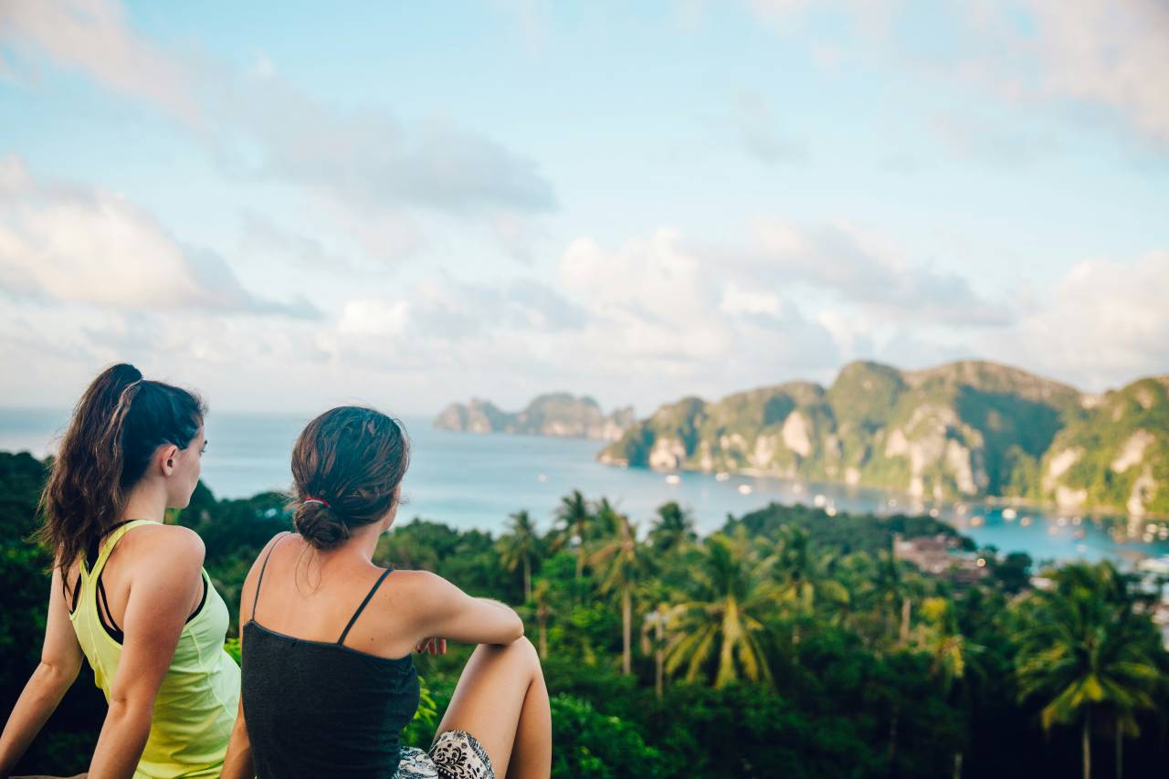 Two people sitting, looking at a view