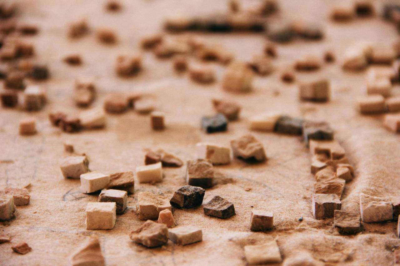 a picture of small stones on a desert floor