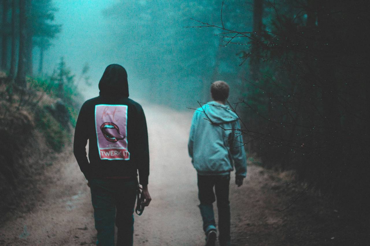 a photo of two young people walking