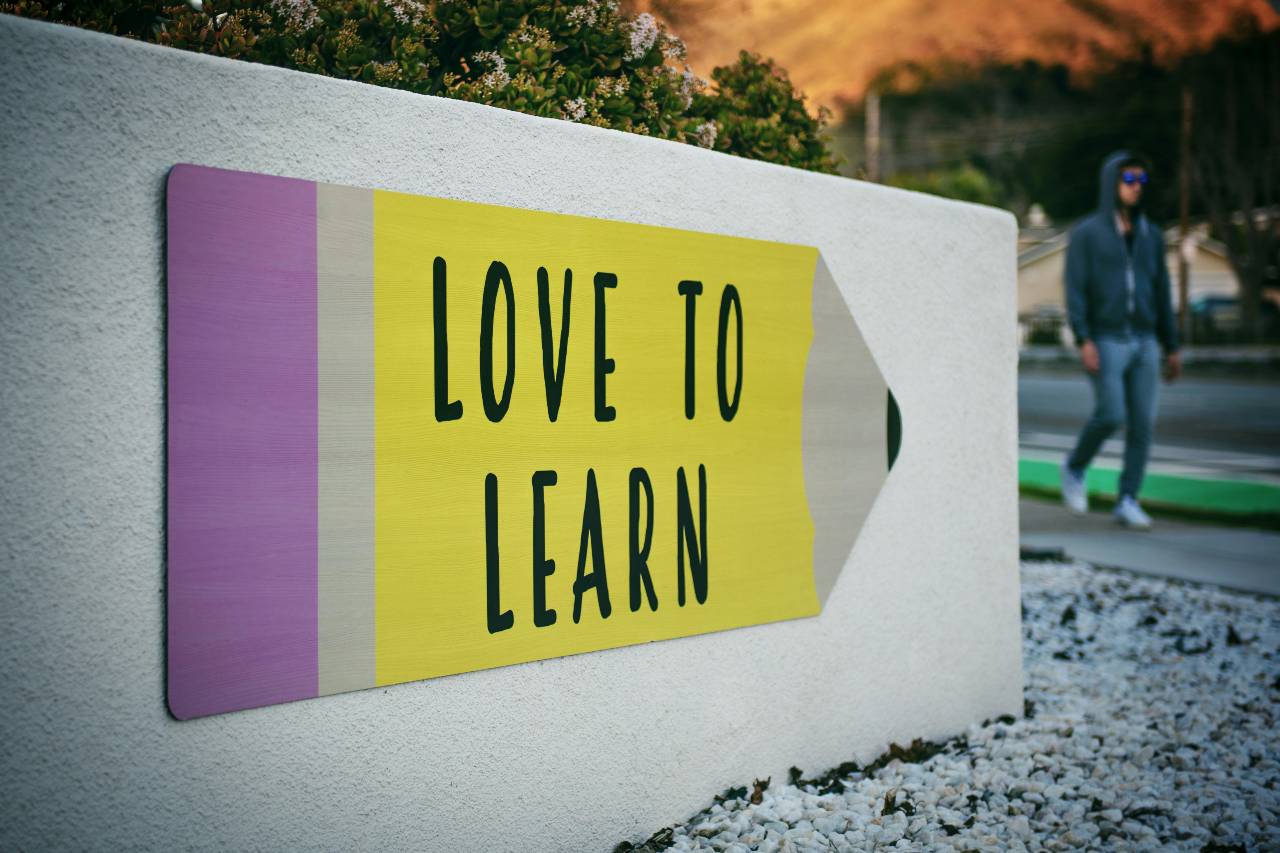 a photo of a mural that reads "love to learn"