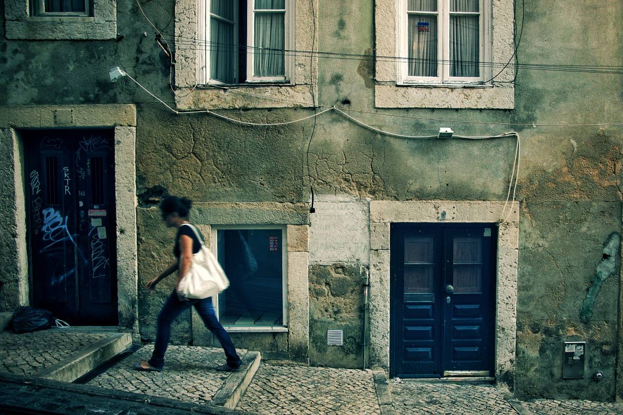 A person walking up an alley