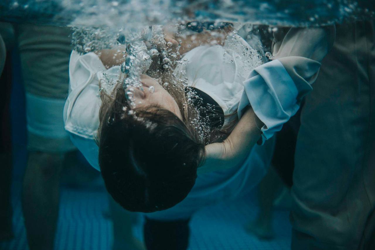 a photo of a person being immersed in baptism