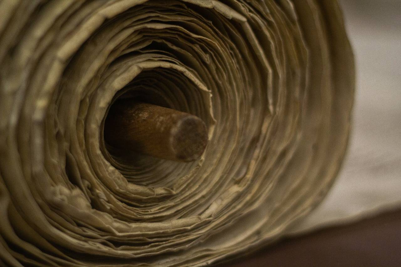 a close up photo of a scroll used in a synagogue