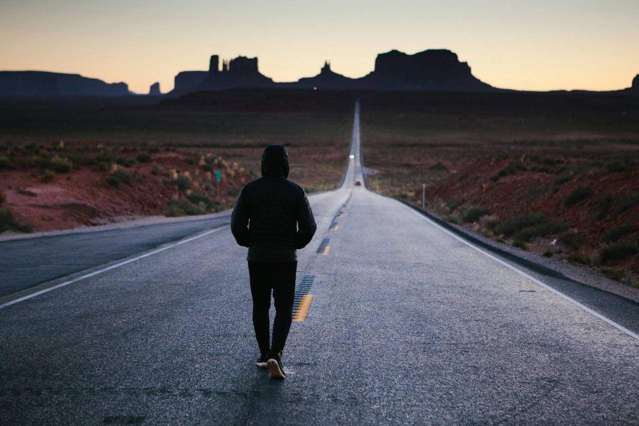 a person walking on a road