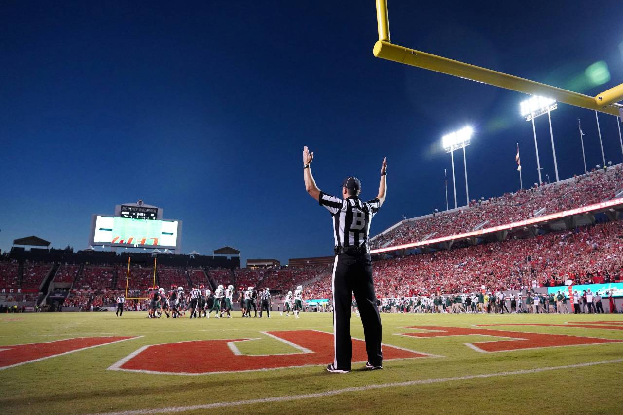 a referee signaling a touchdown