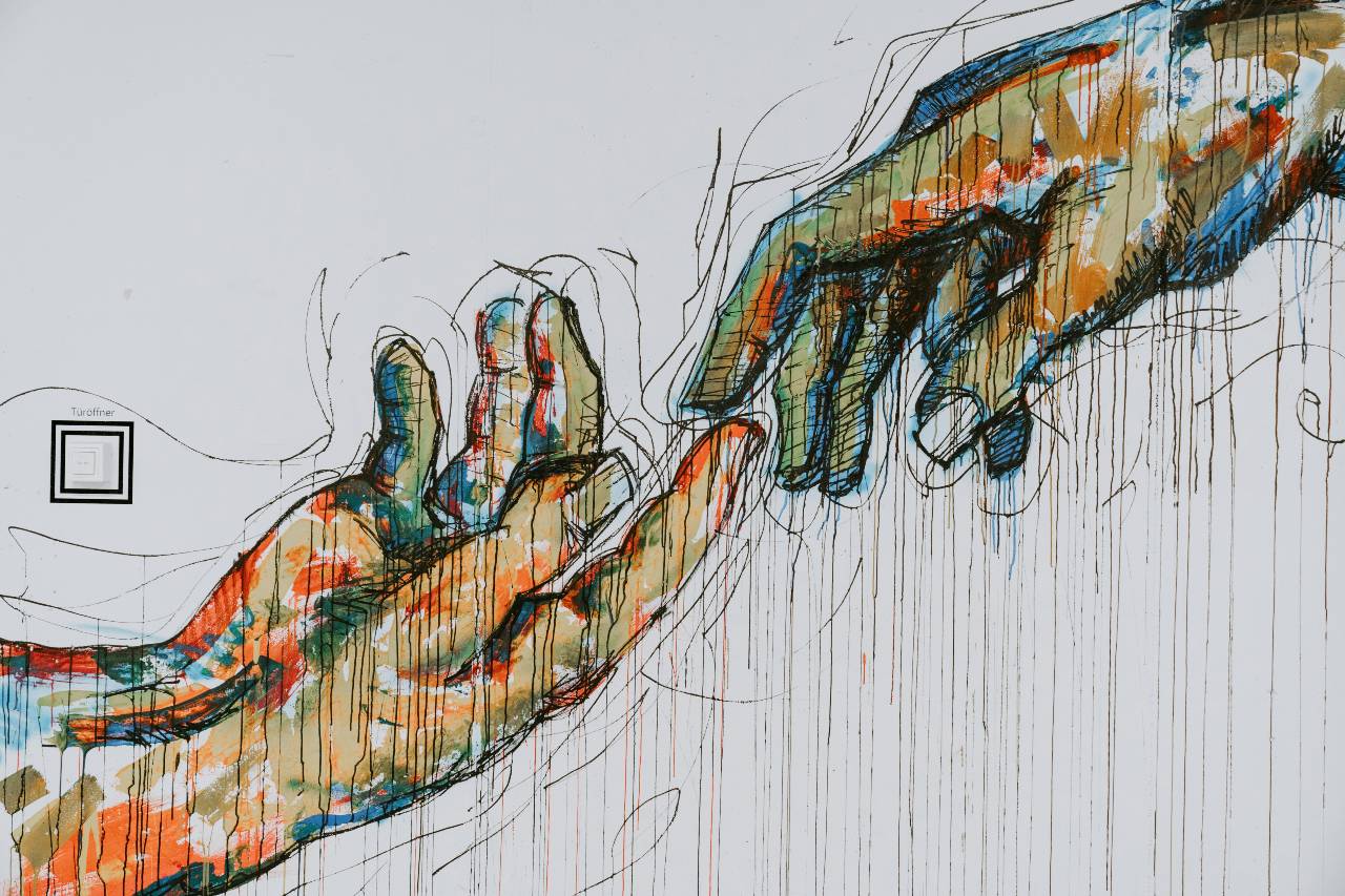 a painting of two hands touching at their fingertips