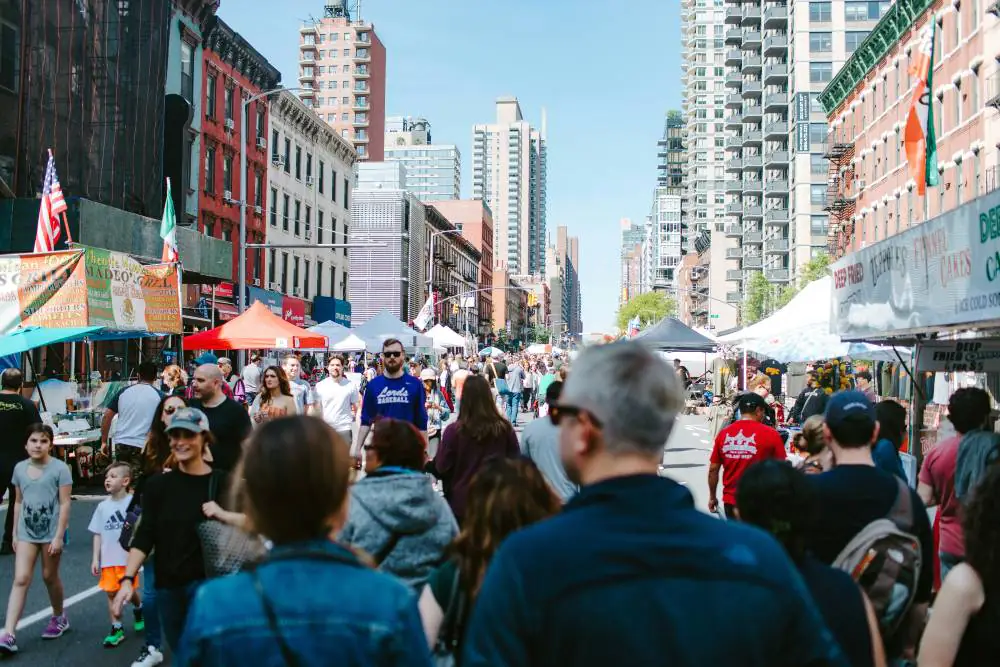 people walking a street fair