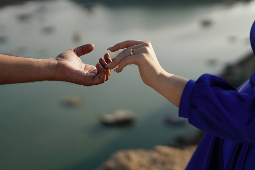 two hands reaching out
